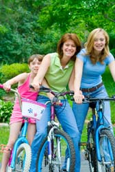 Girls and mother on bikes